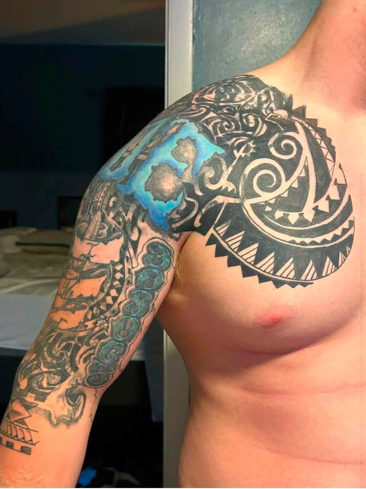 Polynesian style shoulder and chest piece with a panel of colour.