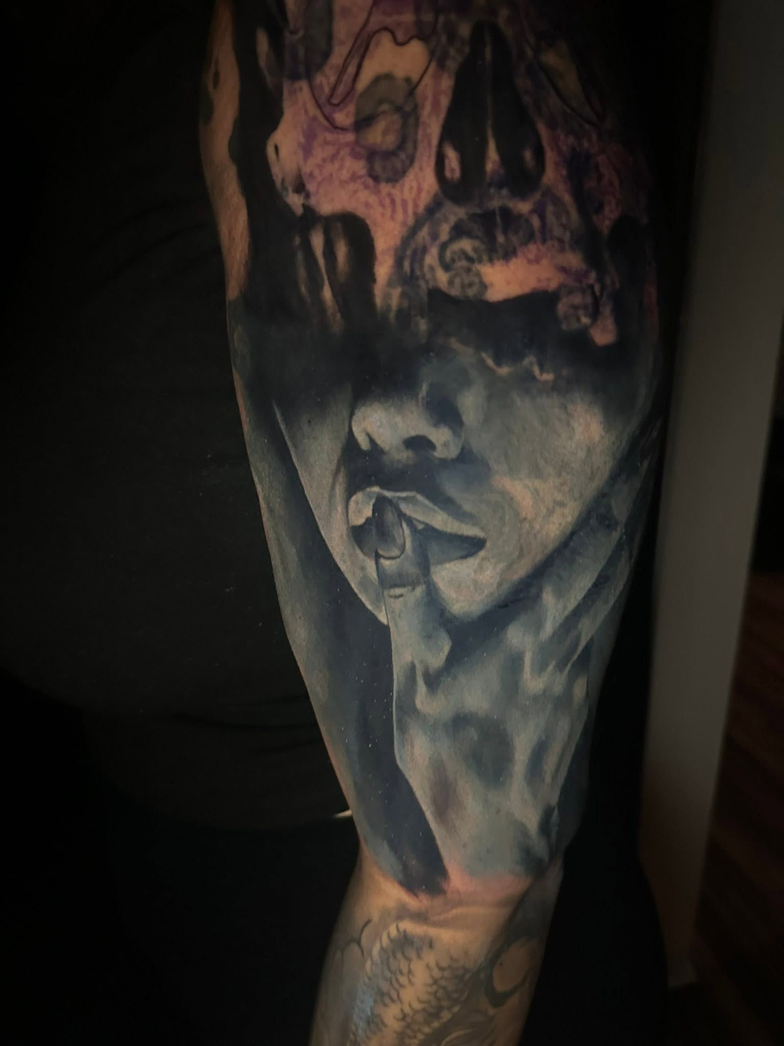 Black and grey sleeve featuring a skull and a shrouded figure.
